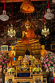 Bangkok Wat Arun - Main Buddha image inside the ubosot with two disciples.  